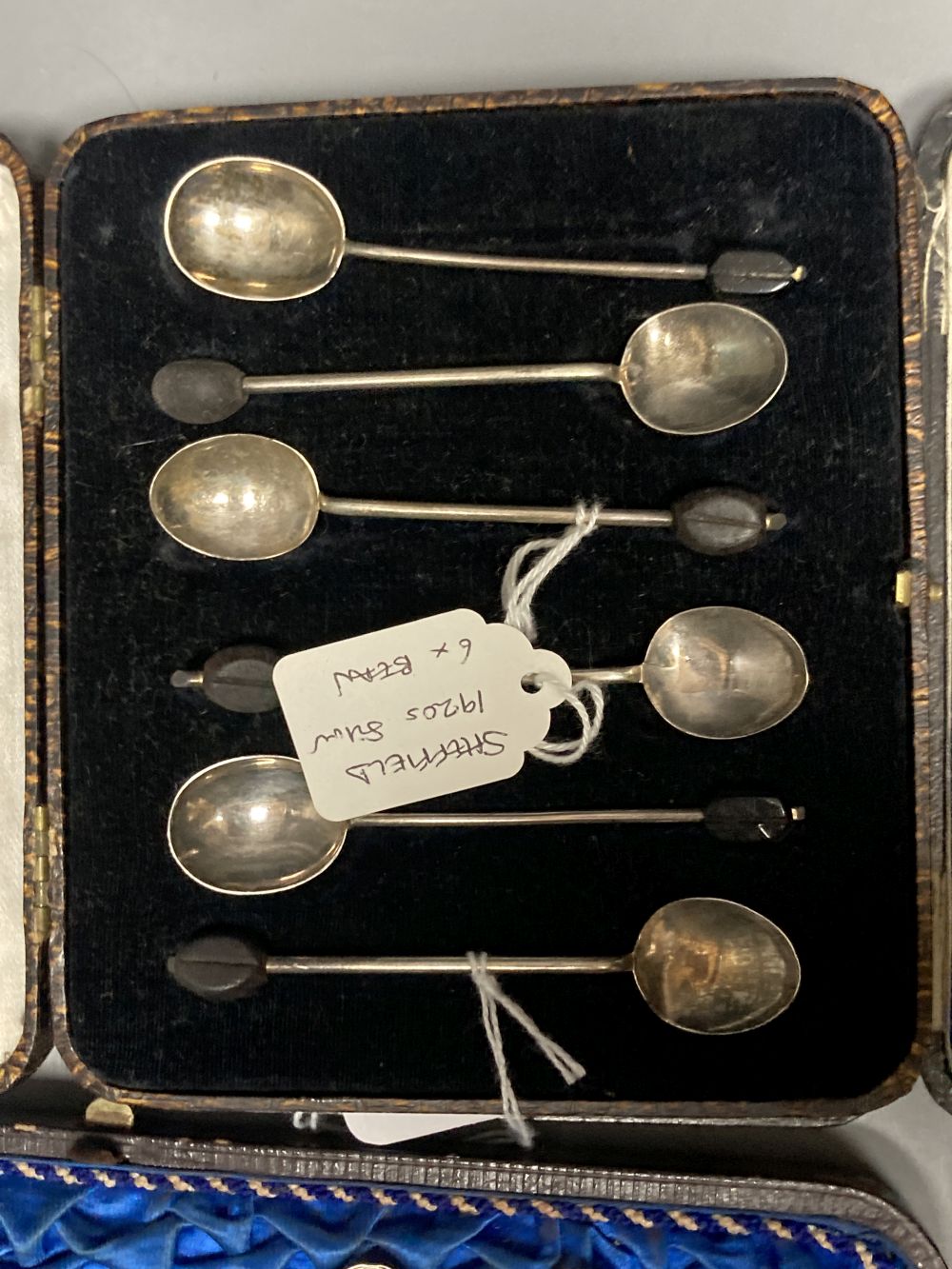 Twelve Victorian silver Apostle coffee spoons and sugar tongs, and three sets of six silver bean end coffee spoons, all cased